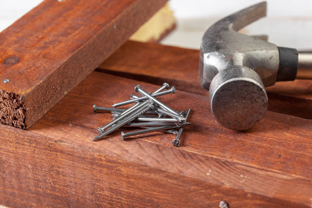 Hammer and nails on wood background - Photo, image
