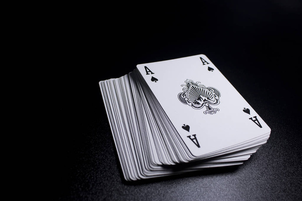 close up view of stack of poker cards on black background - Photo, Image