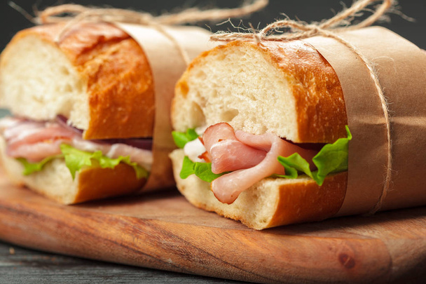 sandwich on a wooden table - 写真・画像