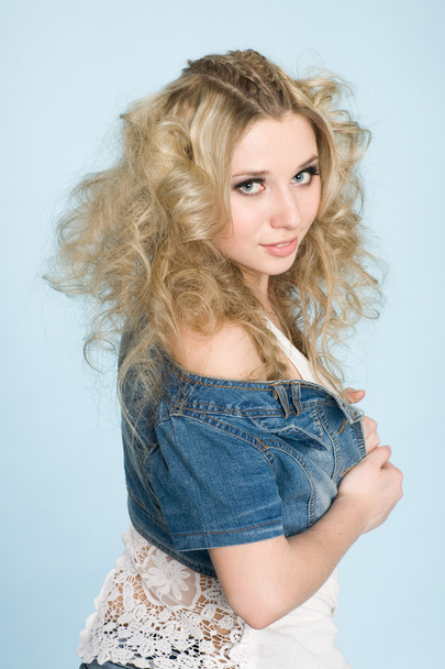 Young girl with blond curly hair - Фото, изображение