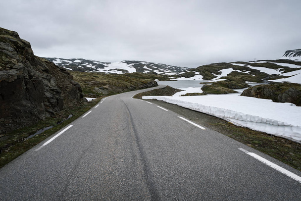 Aurlandsfjellet - national scenic route in Norway. Snow road Bjorgavegen. Severe northern landscape - Photo, Image