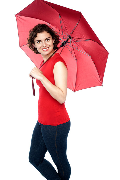Young woman posing under umbrella - Фото, изображение