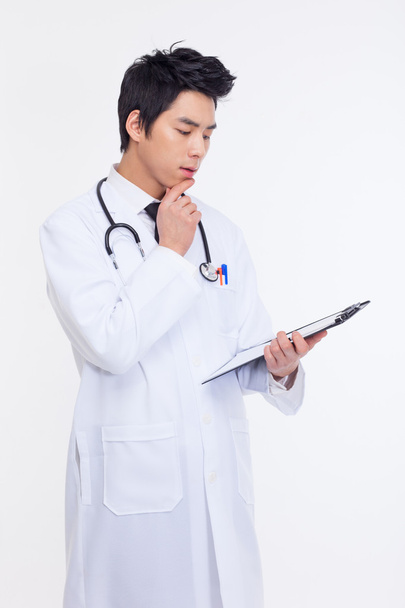 Thinking young Asian doctor - Photo, Image