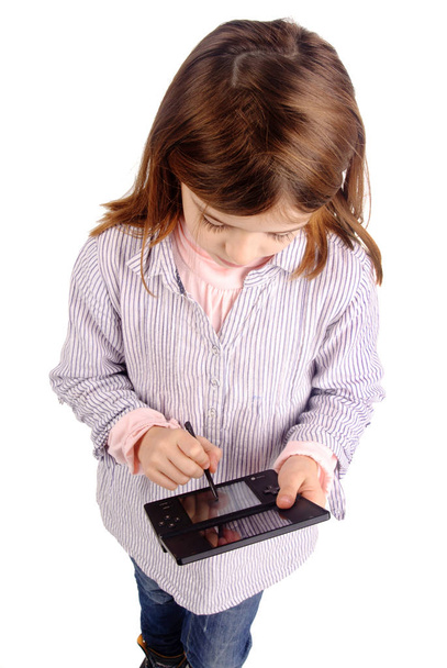 little girl playing video game - Fotó, kép