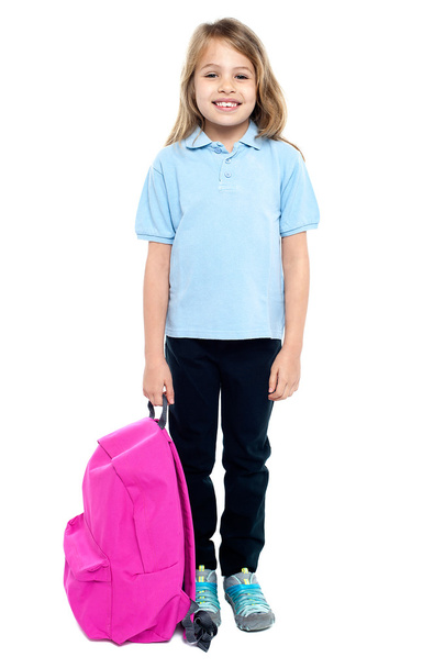 Happy little girl carrying school bag - Foto, Imagen