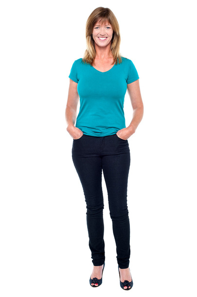 Casual trendy woman with hands in jeans pocket - Photo, Image