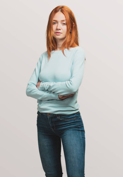portrait of a pretty redhead girl crossed arms - Фото, изображение