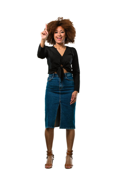 full body afro woman touching with finger - 写真・画像