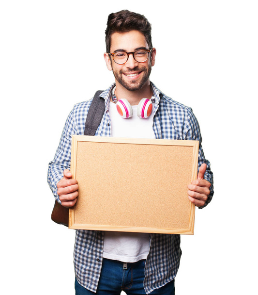 student man holding a corkboard isolated on white background - Φωτογραφία, εικόνα