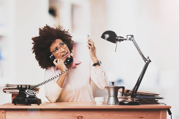 Business black woman very busy working in the office - 写真・画像