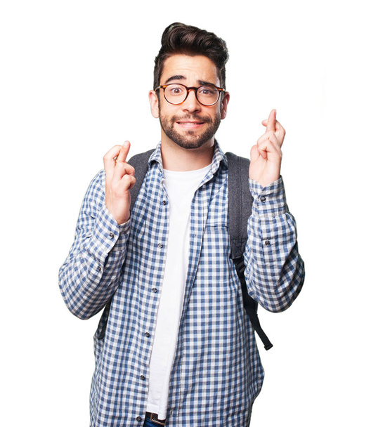 φοιτητής άνθρωπος που διασχίζουν τα δάχτυλά του να απομονωθεί σε λευκό φόντο - Φωτογραφία, εικόνα