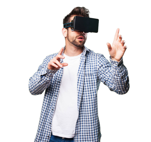 young man wearing virtual reality glasses isolated on white background - Photo, Image