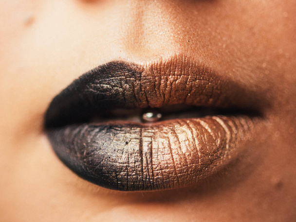 Close-up of lips and piercings in the tongue. Fashionable concept. - Foto, afbeelding