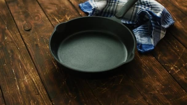 Cast iron pan on table - Footage, Video
