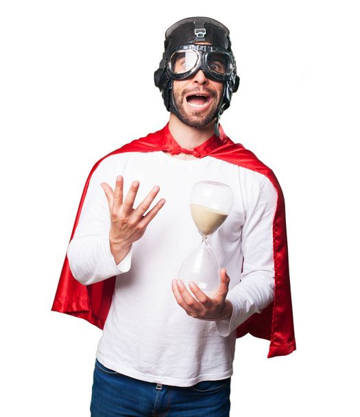 super hrdina drží písek časovač izolovaných na bílém pozadí - Fotografie, Obrázek