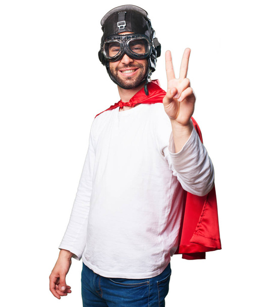 super hero doing victory gesture isolated on white background - Photo, Image