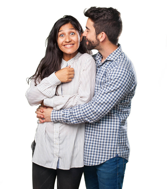jeune couple chuchotant isolé sur blanc
  - Photo, image