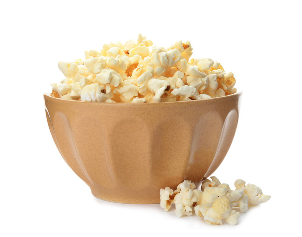 Bowl with delicious fresh popcorn on white background - Foto, imagen