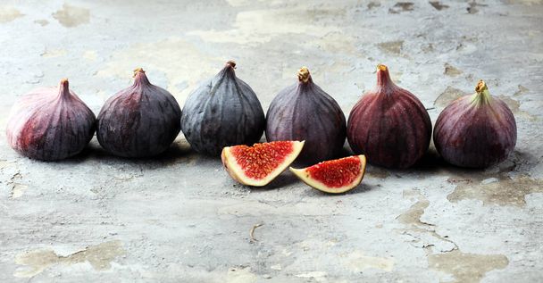 Fresh figs. Food Photo. whole and sliced figs on rustic background - Photo, Image