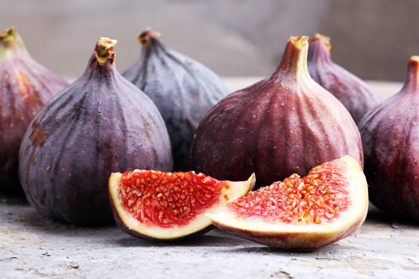 Fresh figs. Food Photo. whole and sliced figs on rustic background - Photo, Image