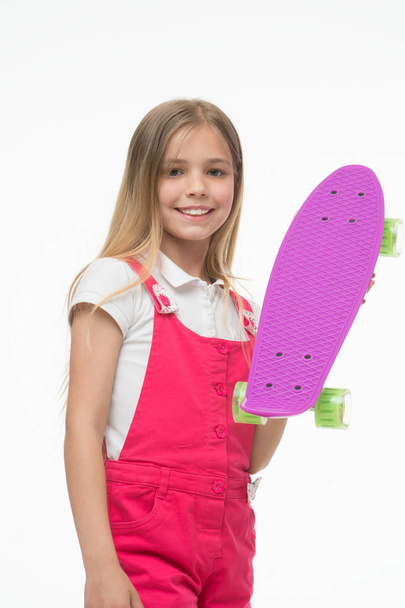Little girl with penny board. Girl skater with penny skateboard. Little hipster skateboarder. Cute hipster. Enjoy vibes on penny board. Cruise till you can cruise no more - Photo, Image