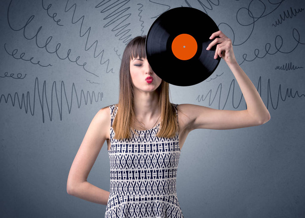 Lady holding vinyl record - Foto, imagen