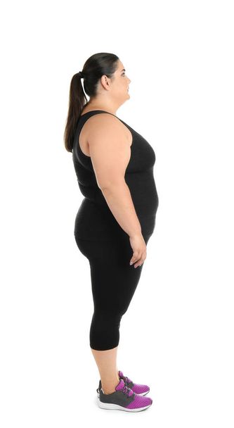 Overweight woman with measuring tape on white background - Valokuva, kuva