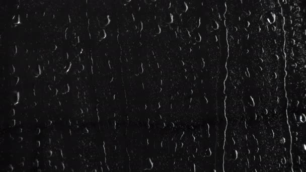 Gotas molhadas de água no fundo preto, 4k
 - Filmagem, Vídeo