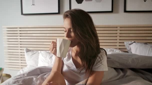 Happy woman starting day from morning coffee - Кадры, видео