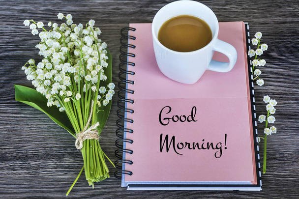 Notebook,Lily of the Valley  and Cup of Coffee for Good Morning .Spring Morning Concept - Foto, imagen