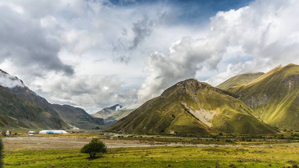 Beautiful landscapes with high mountains of Georgia, dramatic sky - Photo, Image