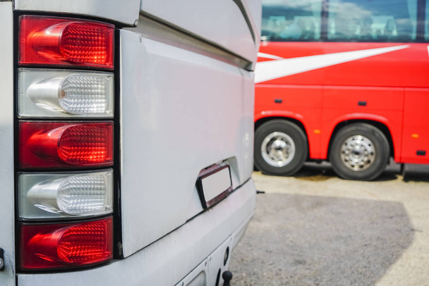 Line of the tourist buses from the rear. focus on red and white rear light - 写真・画像