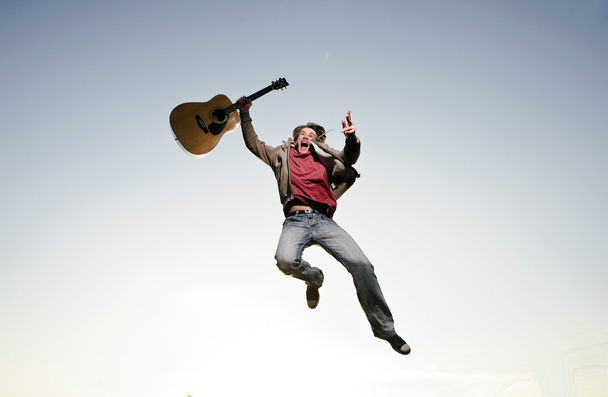 Outside portrait of guitar man dressed to jeans - Foto, Bild