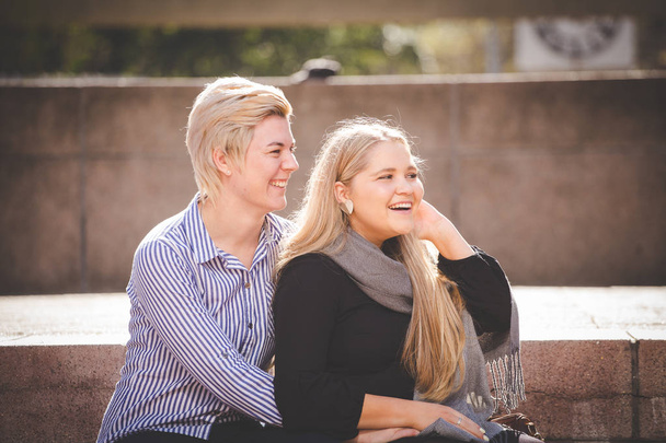 Close up image of a same sex female / lesbian couple  in the Cape Town South Africa city Center - 写真・画像