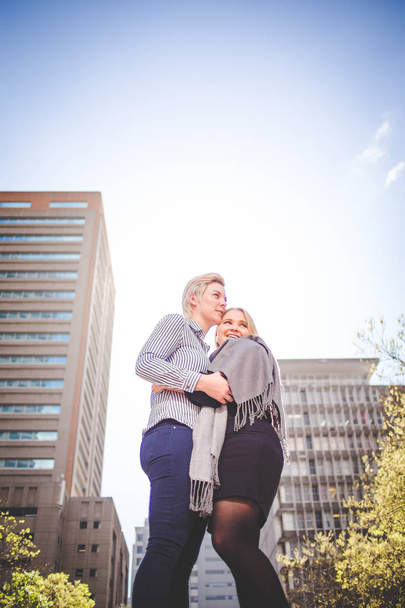 Close up image of lesbian couple kissing  in the Cape Town South Africa city Center - 写真・画像
