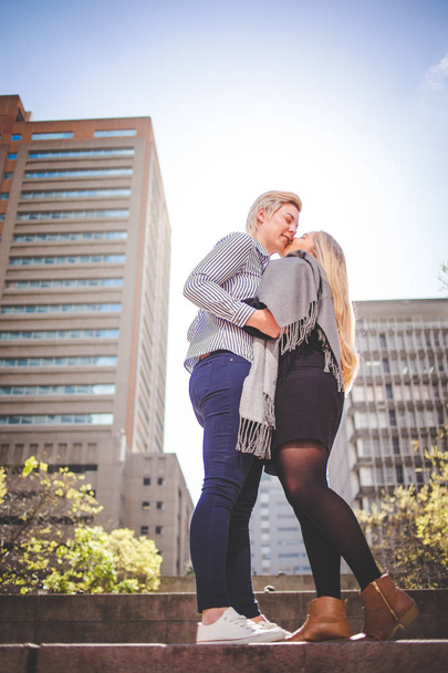 Close up image of lesbian couple kissing  in the Cape Town South Africa city Center - Foto, Bild