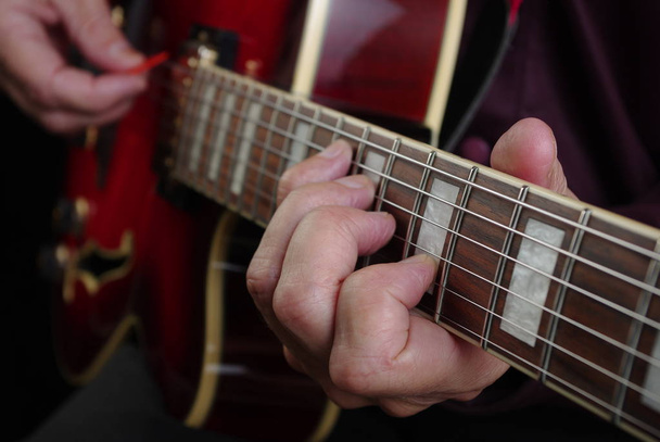 Guitarist hands and guitar close up - Photo, Image