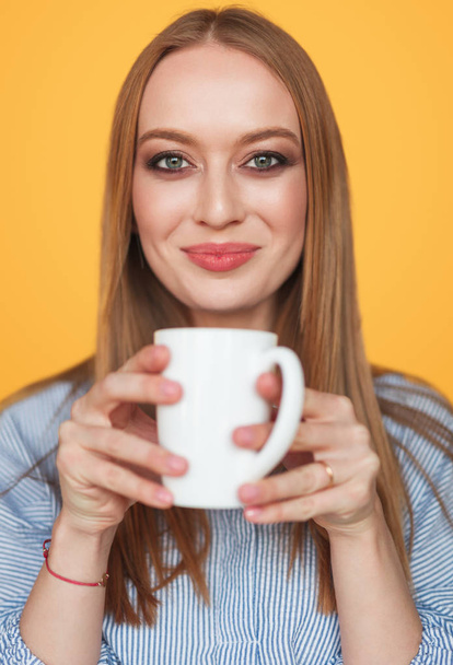 Charming content woman with cup of coffee - Foto, immagini