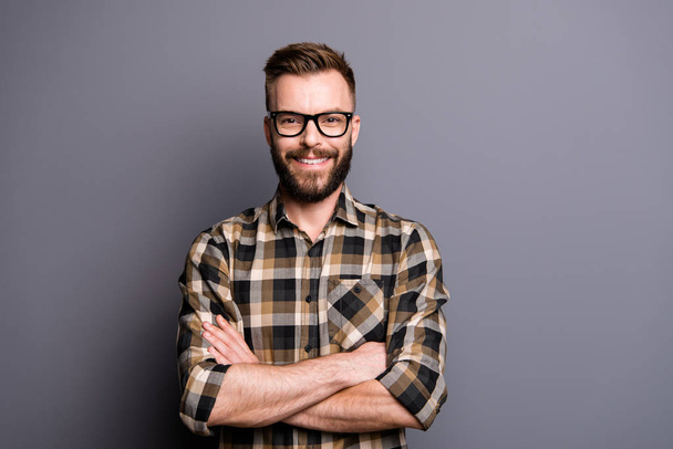 Young handsome man in spectacles and brown checkered shirt look  - Foto, Bild
