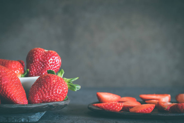 Set with strawberries. Dark rustic background. - Фото, зображення