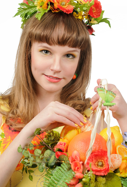 Girl holding basket with fruits and flowers - Foto, immagini