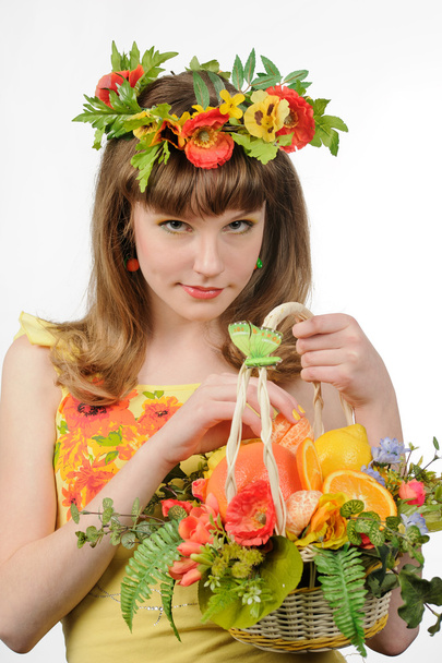 Girl holding basket with fruits and flowers - Foto, Imagem