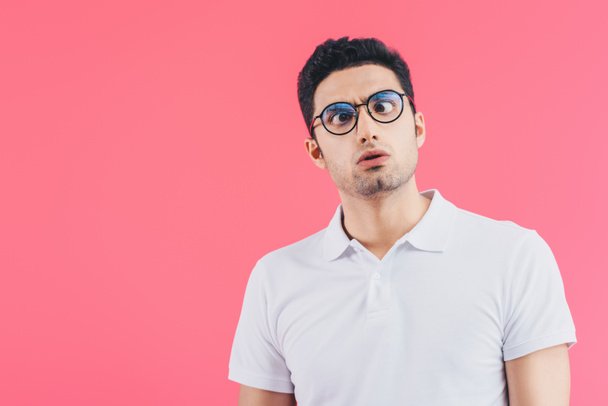 handsome man in glasses grimacing isolated on pink - Photo, Image