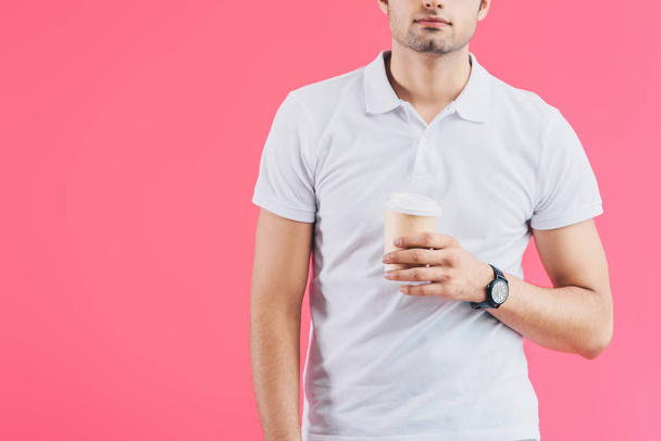 cropped image of man holding disposable coffee cup isolated on pink - Fotoğraf, Görsel