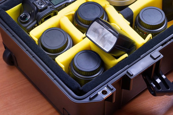 Portable professional photographic equipment, protected in a high resistance suitcase, ready to travel. - Photo, Image