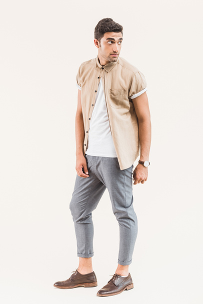 fashionable young man in shirt posing isolated on beige - Φωτογραφία, εικόνα