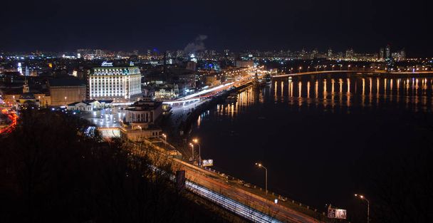 panorama of the night city by the Dnieper river in Kiev - Φωτογραφία, εικόνα