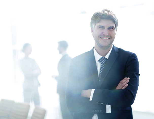 Portrait of confident businessman on office background - Фото, зображення