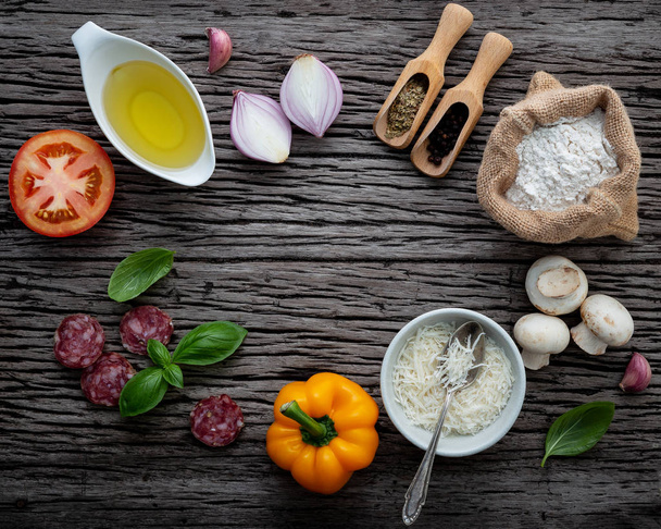 The ingredients for homemade pizza on shabby wooden background. - Photo, Image
