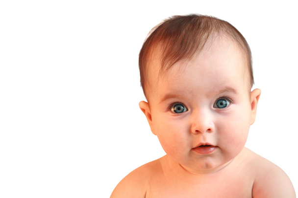 Cute baby girl looking in wide-eyed astonishment - Zdjęcie, obraz